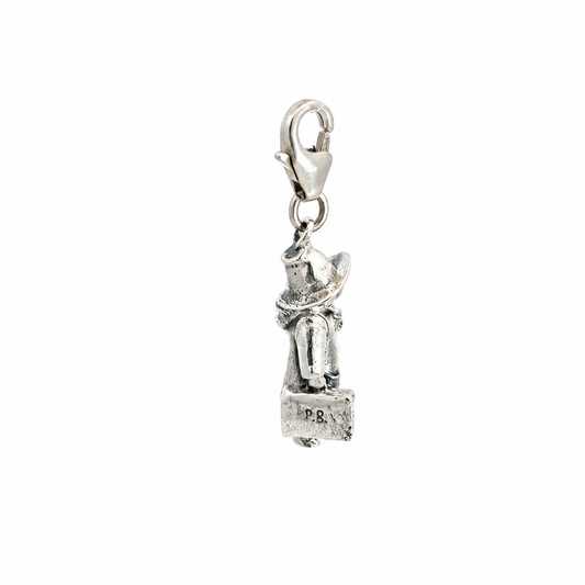 Front view of the sterling silver Paddington clip-on charm showing the detailed 3D character design and lobster clasp fastening.