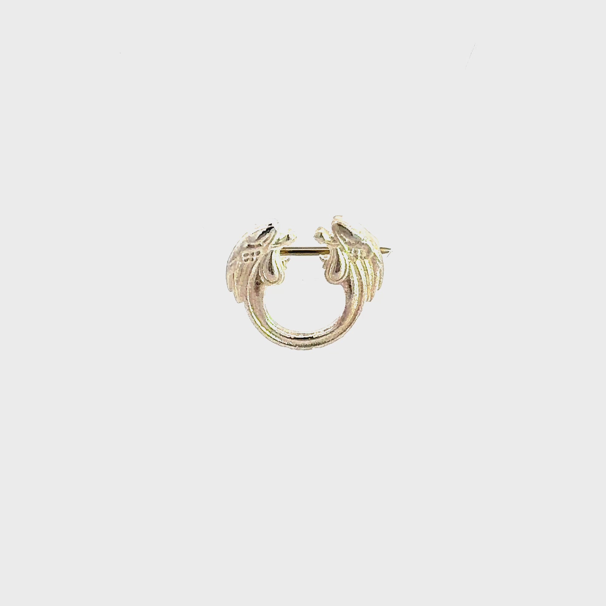 Jesus Christ Superstar silver plated lapel pin brooch front view video turnaround, official Andrew Lloyd Webber theatre accessory handmade in the UK.