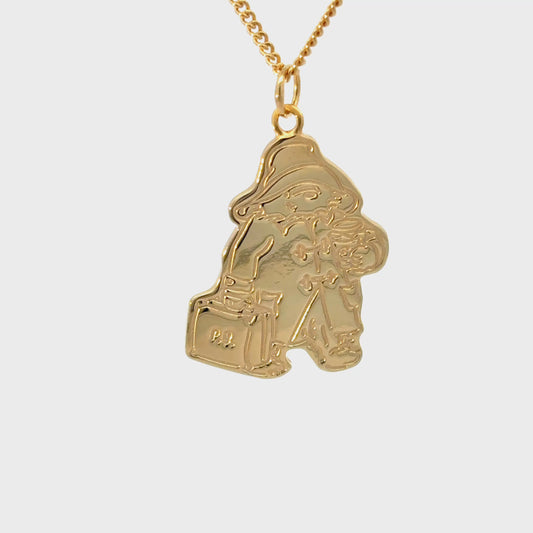 Turnaround 360 view of Paddington™ Necklace pendant in gold vermeil highlighting detailed engraving of coat, suitcase, and marmalade jar.