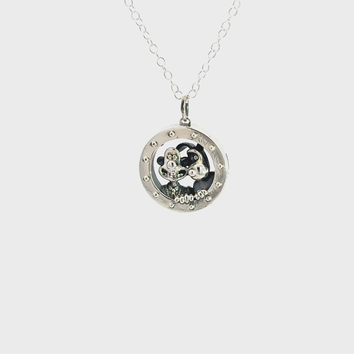 Video showcasing the Wallace & Gromit A Grand Day Out sterling silver porthole necklace and its detailed rocket window design.