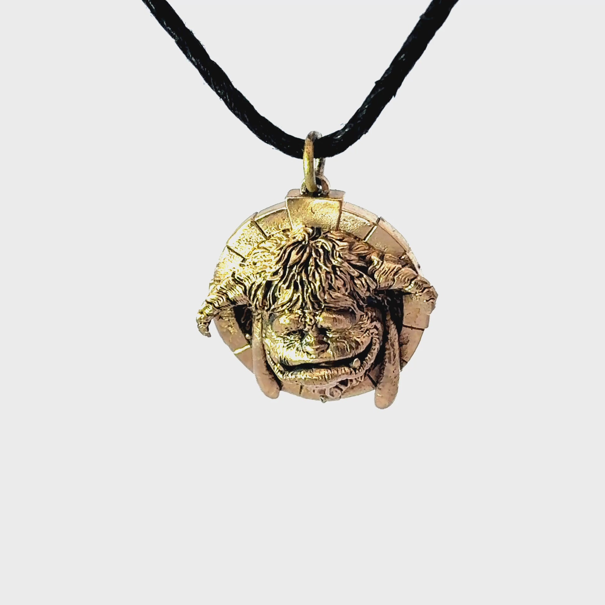 Licensed To Charm Labyrinth Ludo bronze necklace displayed for a 360-degree turnaround view