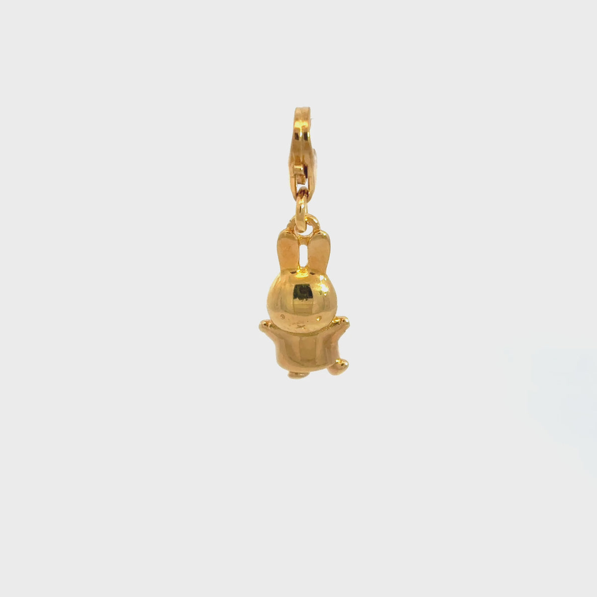 Video showcasing the Miffy Jumping Clip-On Charm in 18ct gold vermeil, highlighting its three-dimensional design and polished golden finish.