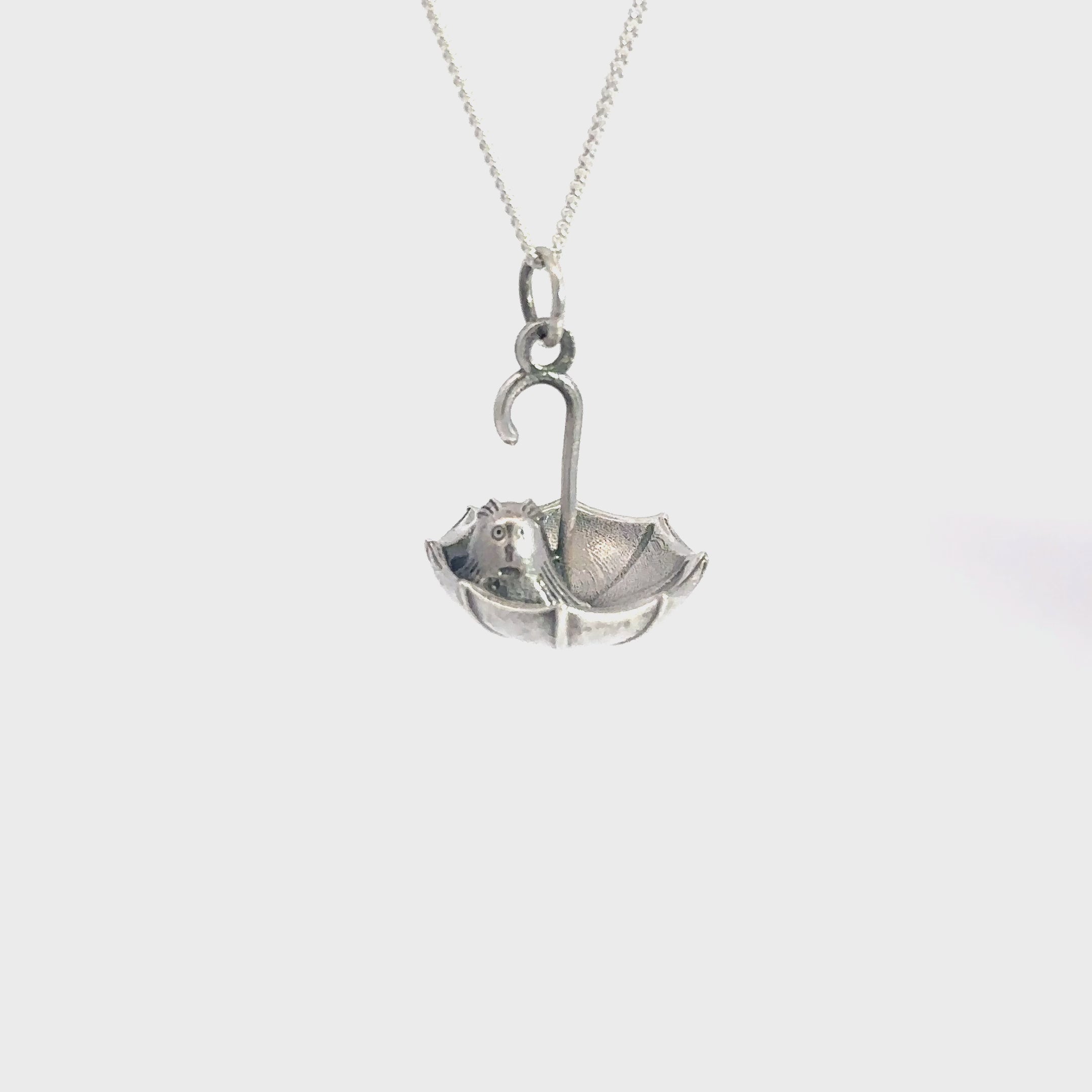 Detailed sterling silver necklace of a Nibling peeking from an umbrella, crafted on a 45 cm trace chain for a charming Moomin accessory.