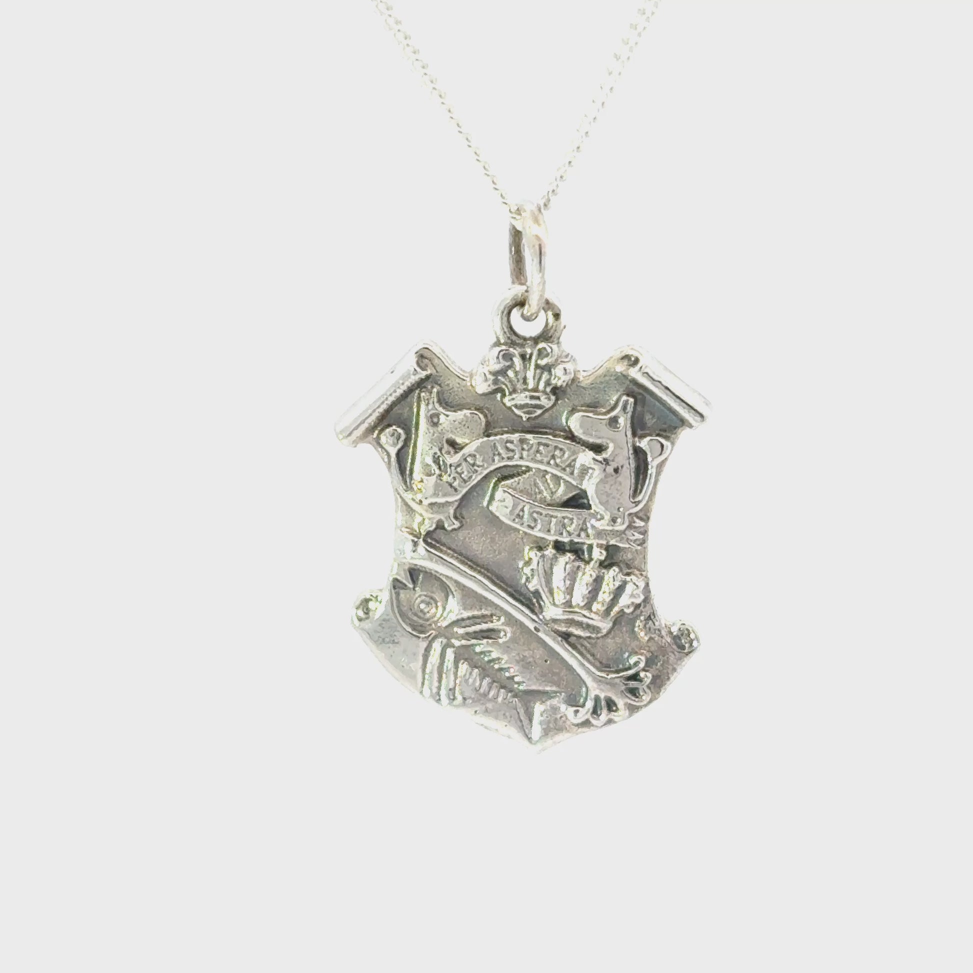 Licensed To Charm Close-up of the Moomin Crest pendant on a fine sterling silver chain, handmade in the UK 360 turnaround