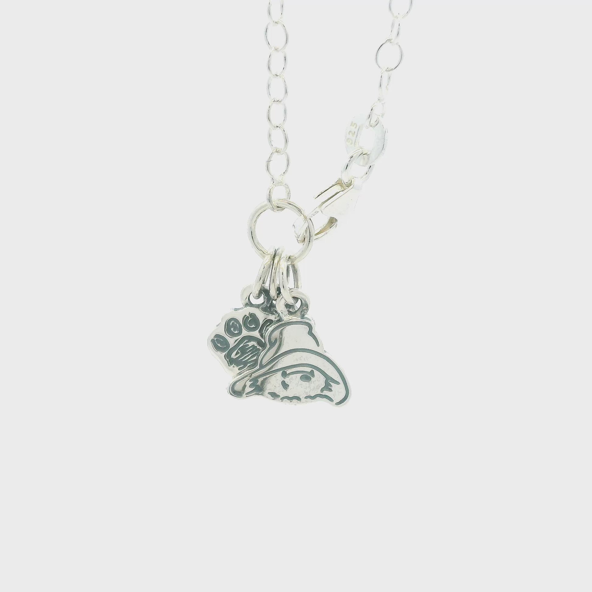 Video thumbnail — rotating view of Paddington sterling-silver triple charm bracelet