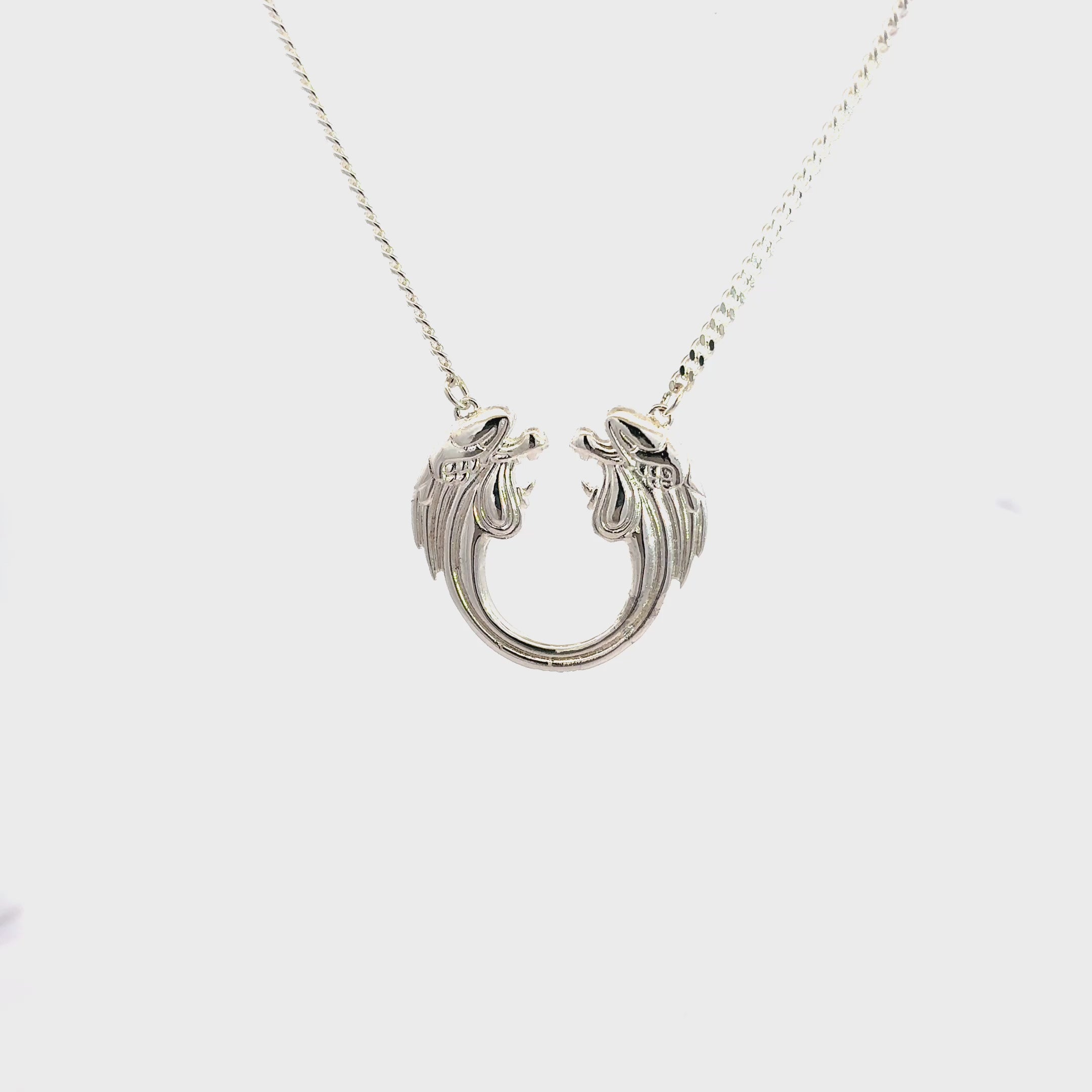 Jesus Christ Superstar sterling silver logo necklace with full chain and pendant video tunaround shown on a white studio background