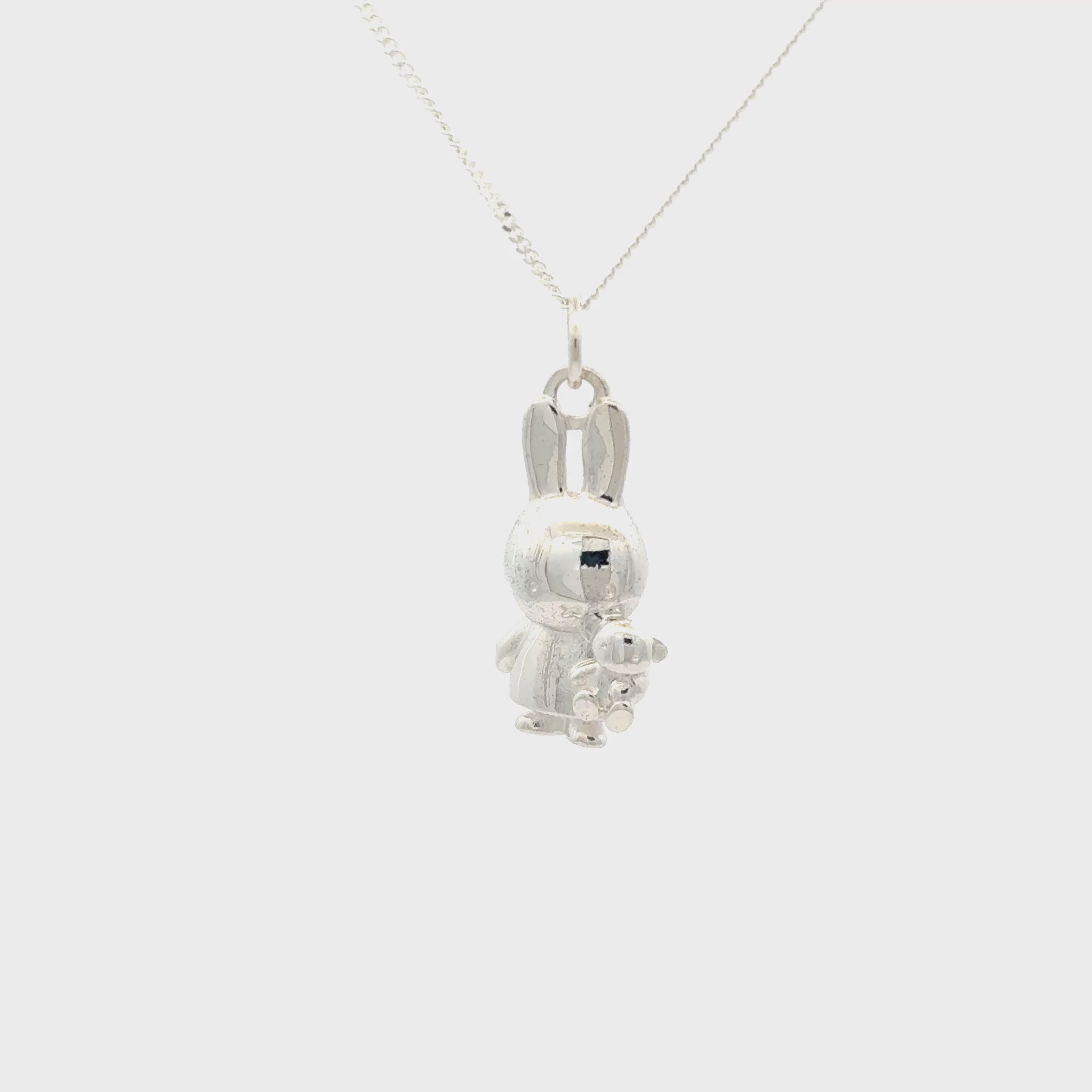 Sterling silver Miffy Holding Teddy Necklace video turnaround featuring a detailed Miffy bunny pendant cuddling her little teddy bear on a silver chain.