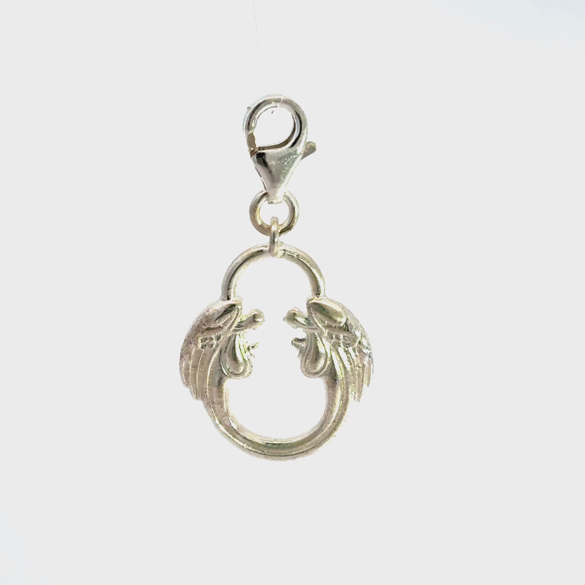 Sterling silver Jesus Christ Superstar logo charm turnaround showing the clasp and back detail on a white background.