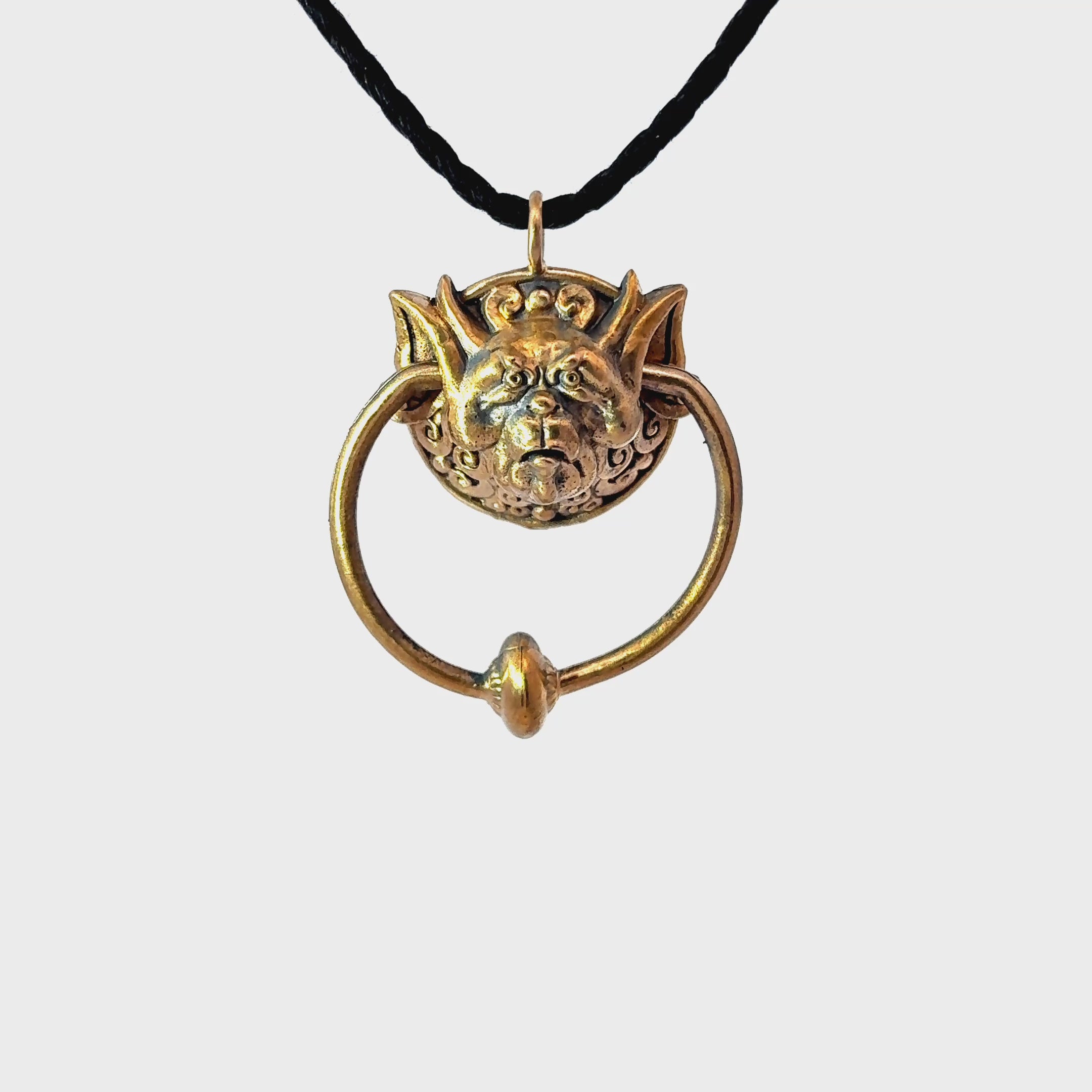 Licensed To Charm Labyrinth Right Door Knocker bronze necklace video turnaround view on black cord