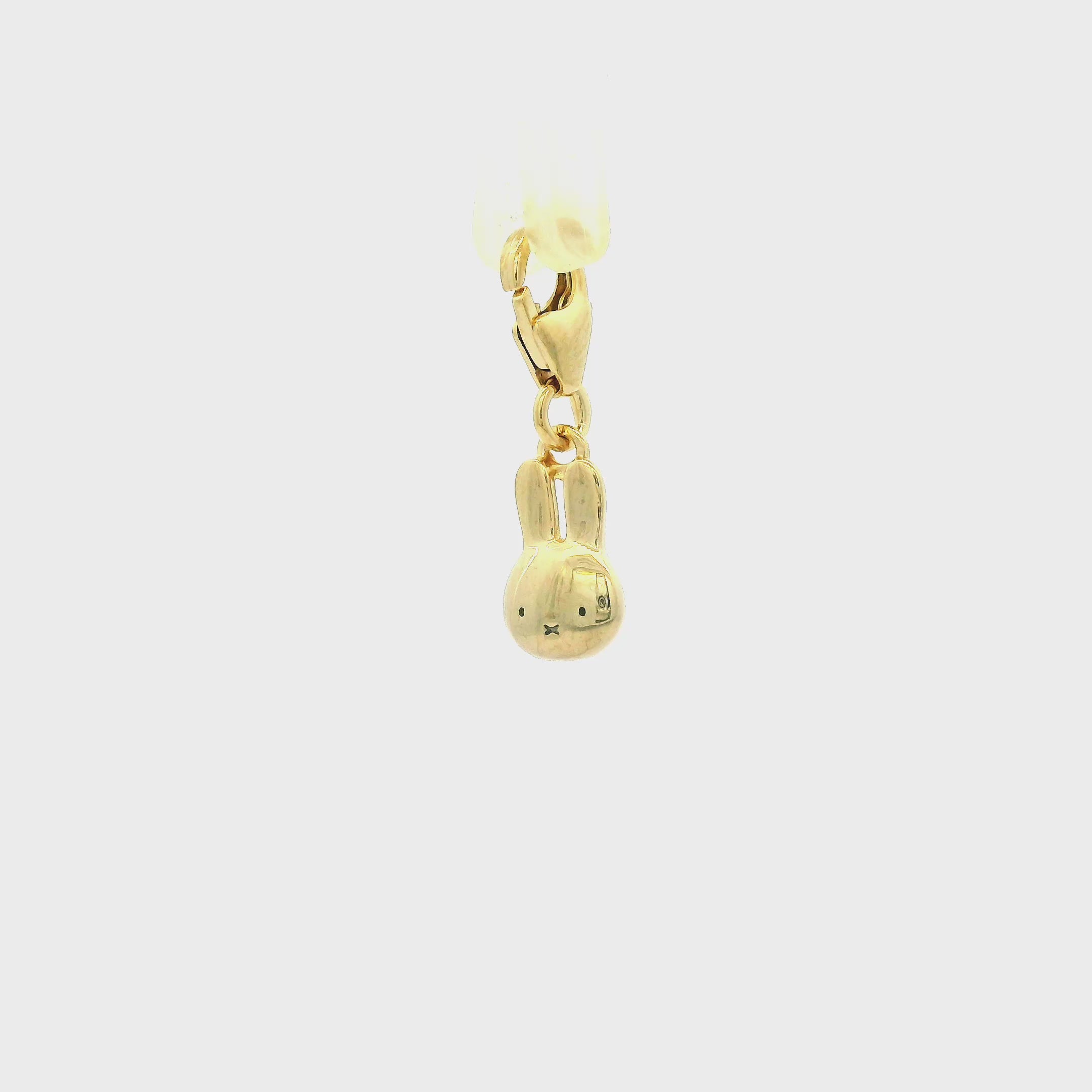 360 turnaround of Miffy Daisy Dress charm in 18ct gold vermeil, showing smooth polished detailing and clip-on fastening. Displayed on a clean white background.