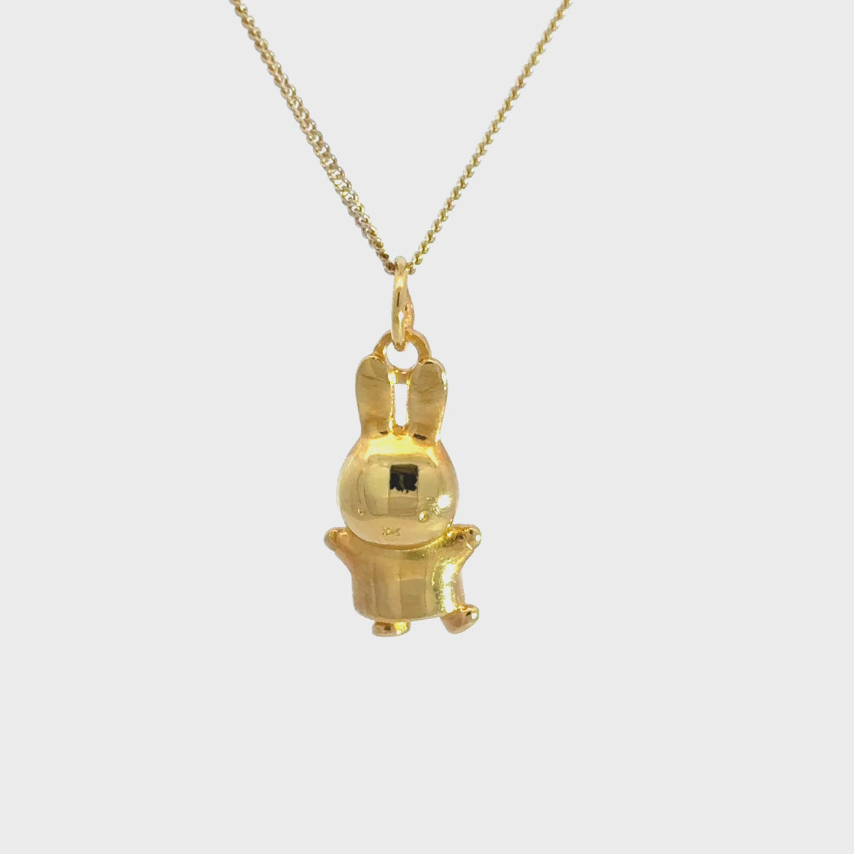 Video showcasing the Miffy Jumping Necklace in 18ct gold vermeil, highlighting the playful three-dimensional bunny pendant and its golden finish.