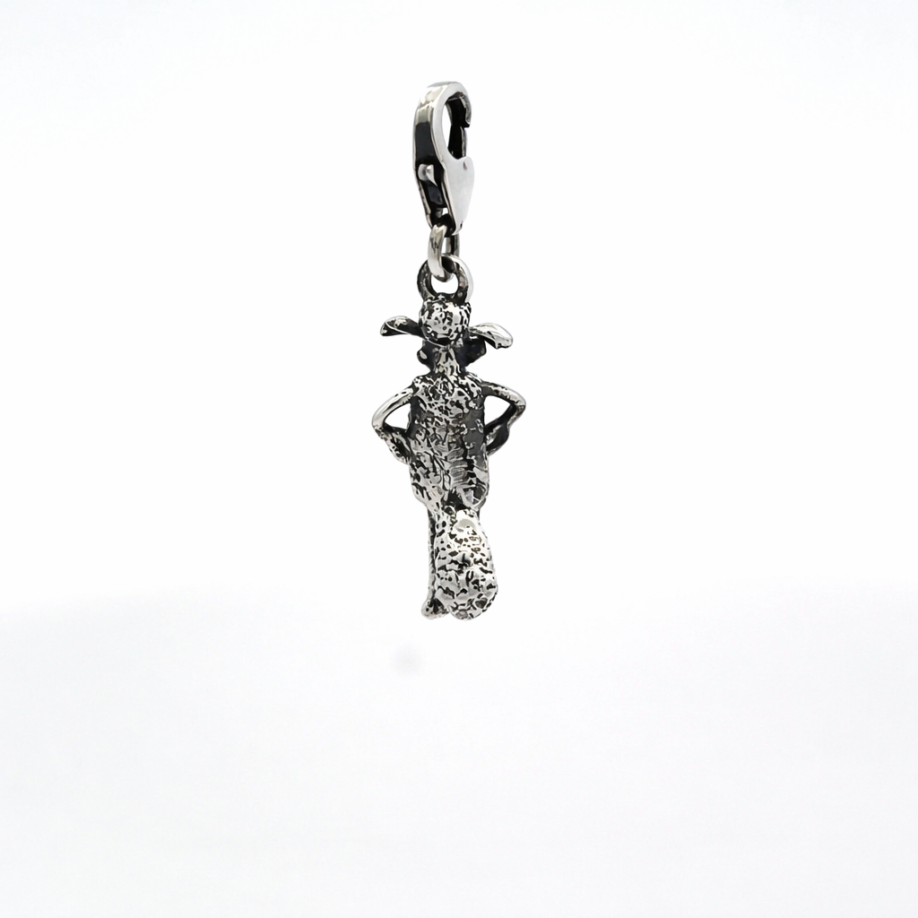 Back view of Shaun the Sheep sterling silver charm showing tail detail and textured finish
