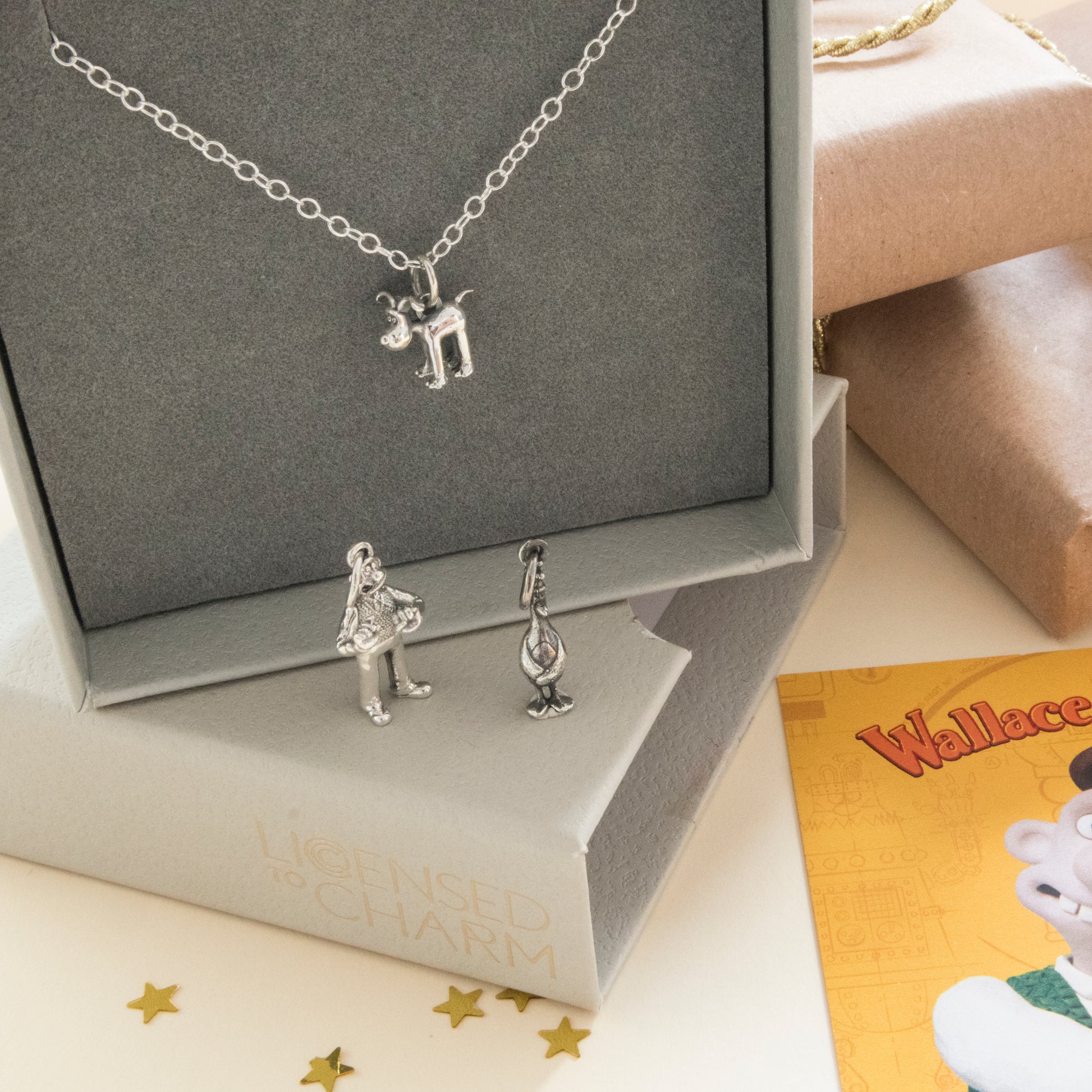 Standing Gromit sterling silver necklace styled as a Wallace and Gromit gift with branded packaging.