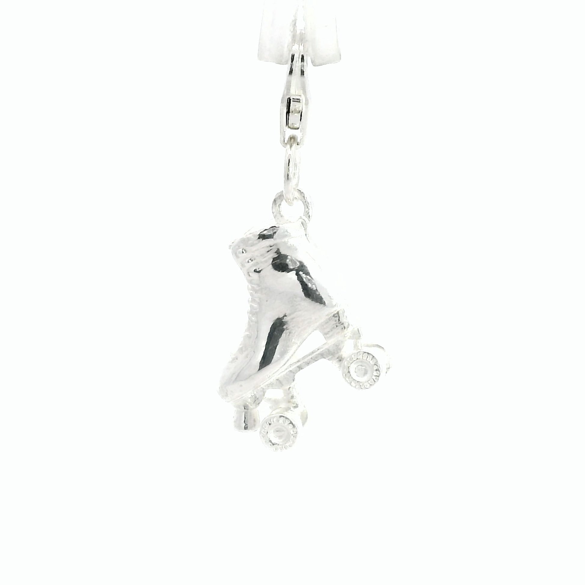 Official Starlight Express roller skate charm in recycled sterling silver with four wheels and clip-on clasp