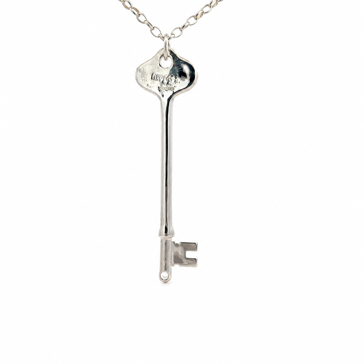 A silver phantom of the opera key-shaped pendant necklace on a matching silver chain, shown against a plain white background.
