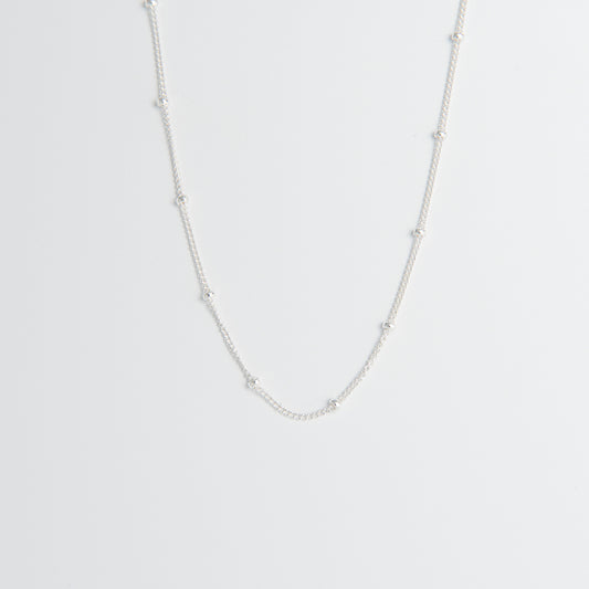 Sterling silver satellite chain necklace featuring polished silver beads. A versatile, dainty chain available in 40cm or 45cm, perfect for layering or wearing solo.