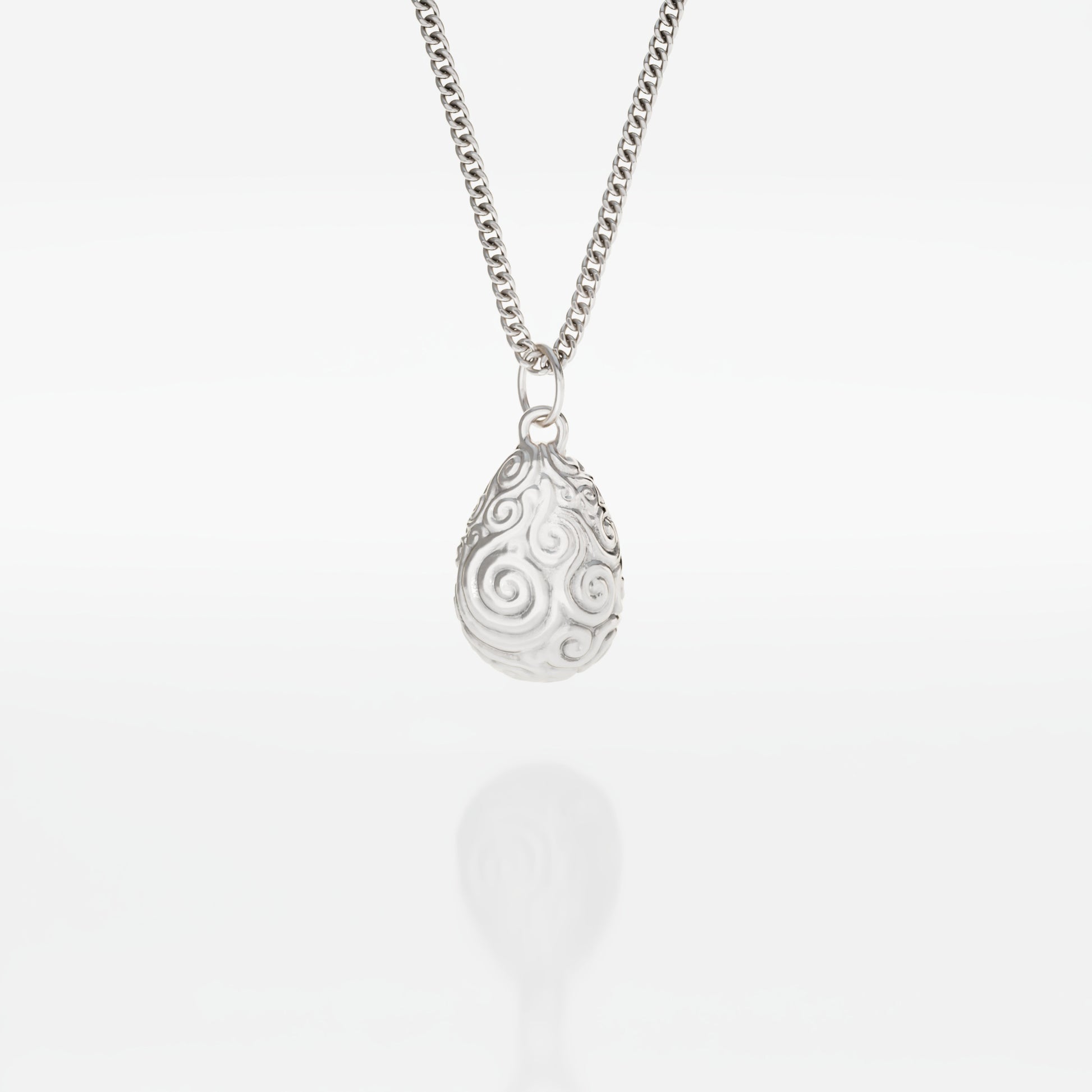 Mystic Valley Pebble Necklace in recycled sterling silver, inspired by The Dark Crystal. Features an intricately etched pebble-shaped pendant, echoing the harmony of the urRu’s valley. Comes on an 18-inch chain.