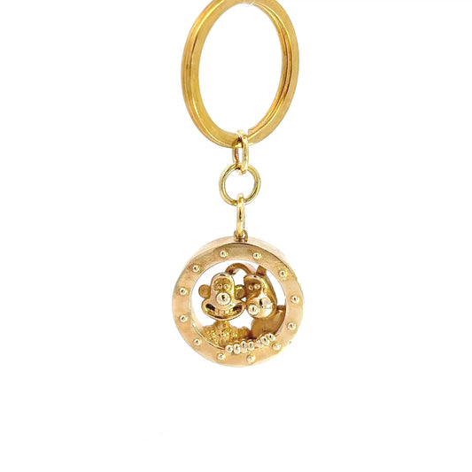 Licensed To Charm Wallace & Gromit brass rocket porthole keyring and bag charm, showing the duo looking through the window