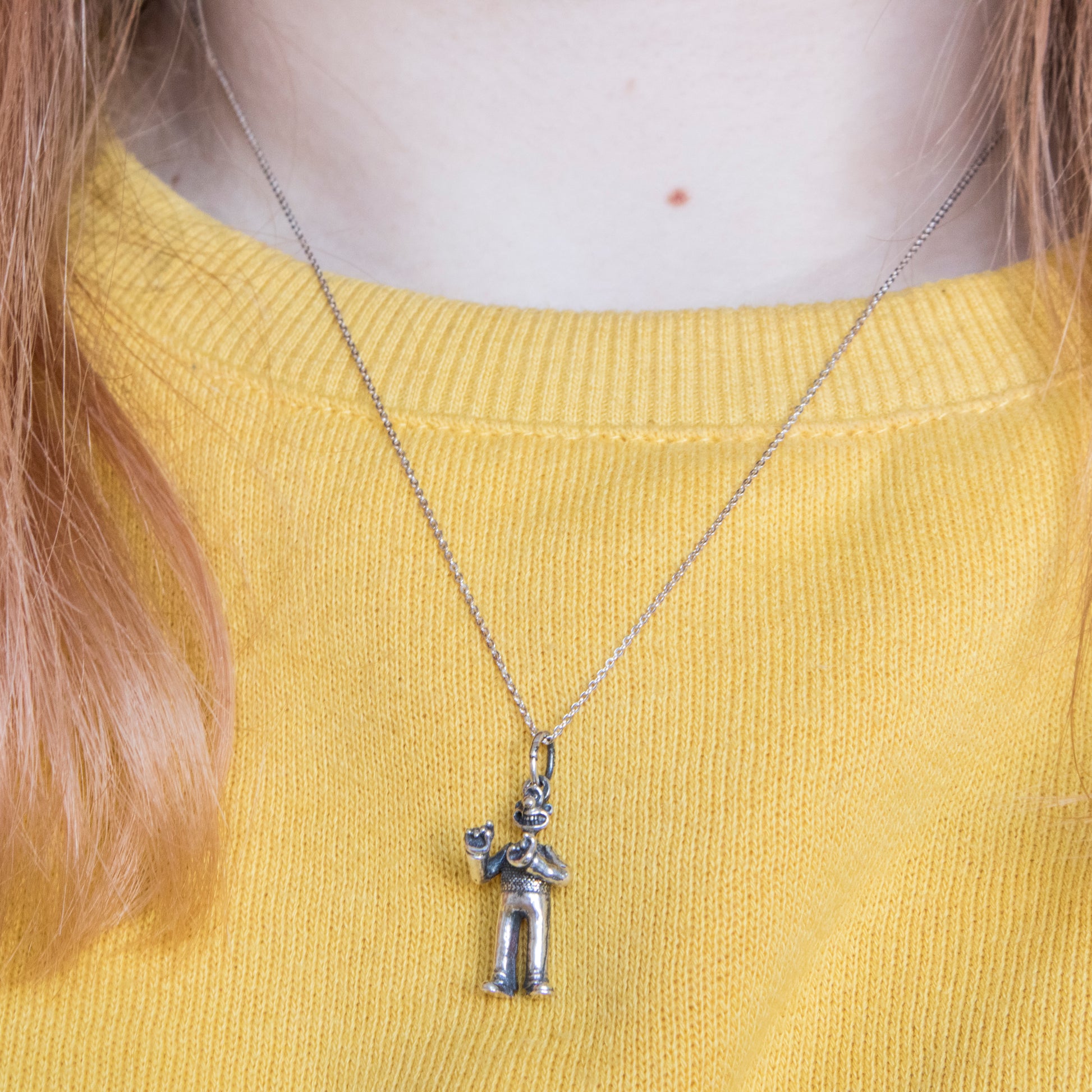 Sterling silver Wallace necklace worn as a playful Wallace & Gromit gift for fans and collectors