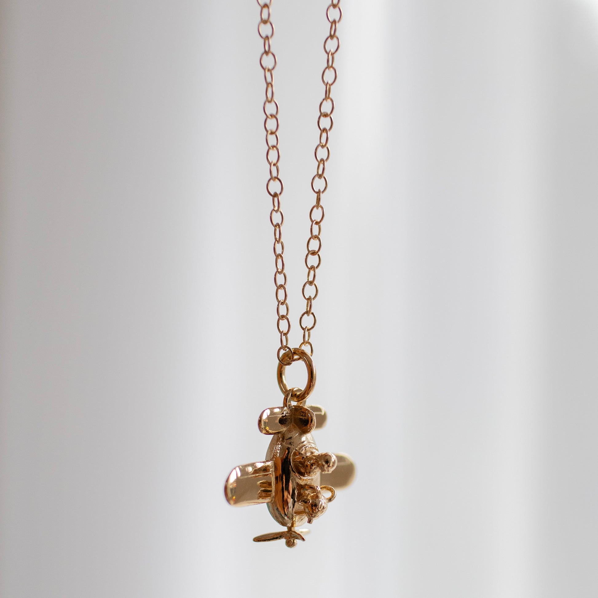Handcrafted Gromit in a Plane Necklace, celebrating 25 years of A Close Shave. Perfect for Wallace & Gromit fans and collectors