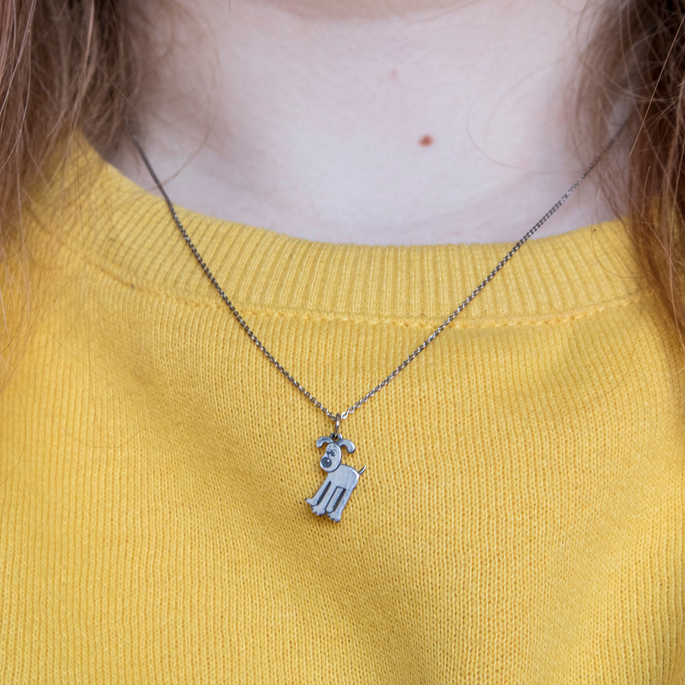 Sterling silver Gromit Kennel Necklace, celebrating 30 years of Wallace & Gromit. Perfect for collectors and Aardman Animations enthusiasts.