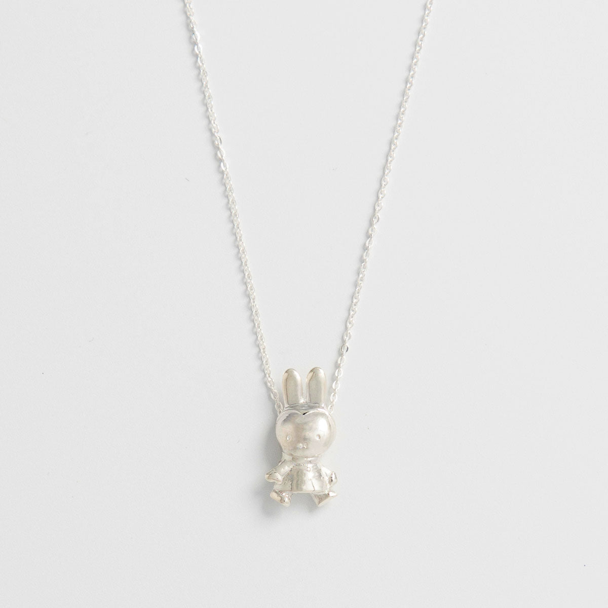 Winter Miffy Necklace in sterling silver, featuring Miffy in a detailed winter coat and scarf. Handcrafted from recycled silver, perfect for gifting